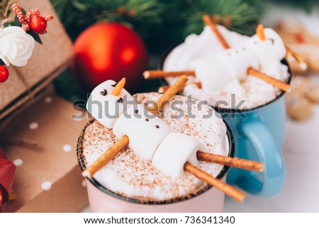 mugs with hot chocolate in which the men from the marshmallow relax. concept of a couple