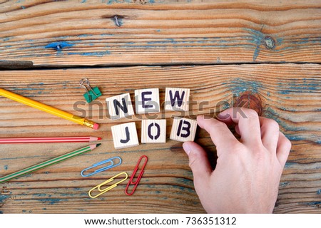 New Job. Wooden letters on the office desk Royalty-Free Stock Photo #736351312