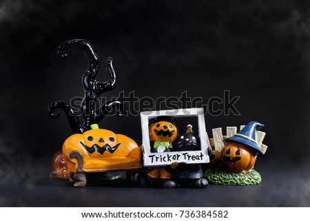 Halloween festival background presents by pumpkin Jack and kitty cat and his friend  playing trick or treat with picture frame stand front of the armchair and the Gothic tree.