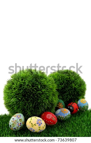 Easter egg,  hand painted beautiful and colorful eggs on fresh grass and white background