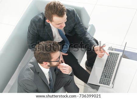 employees working with a laptop
