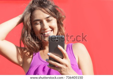 young woman looking at smartphone 
