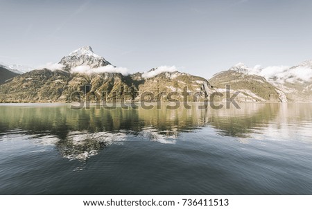 Autumn gorgeous landscape in the Swiss Alps. Mountains reflected in Lake Lucerne.