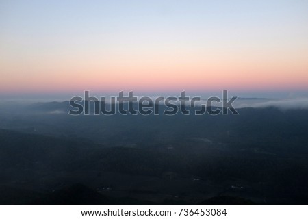 Scenic view of sunrise with red misty sky in Tinker Cliffs hike, Appalachian Trail, Catawba, near Virginia Tech, Blacksburg