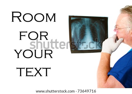 a doctor or surgeon examins his patients xrays isolated on white with room for your text
