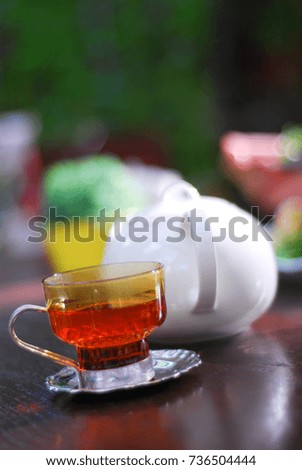 Glass of tea on wood table.