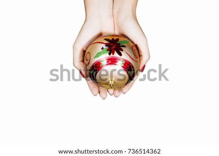 Top view of a woman hands holding a Christmas ball, isolated on white background