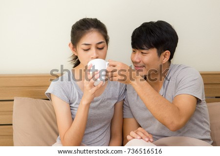relationship of a lover. The husband takes care of his wife who is sick on the bed by seeking medicine.