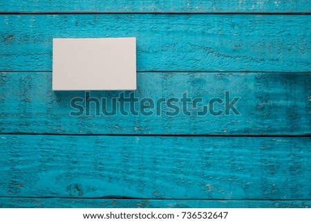 Business card on the antique blue wood.