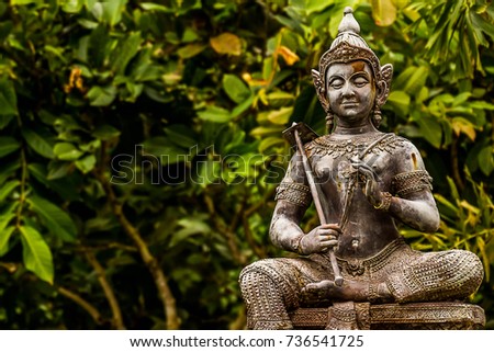 Vishnu holds a rake on his shoulder to symbolize the deity.