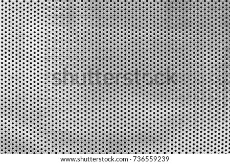 metal plate with many black dots texture background