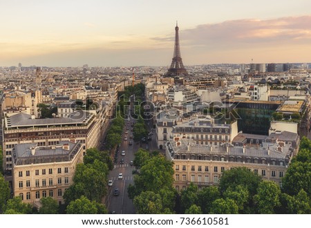 Scenic rooftop view of Paris, France, from the Triumphal Arc with the Eiffel Tower in the background. Summer travel background.