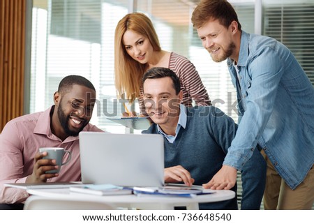 Concentrated people watching news on computer