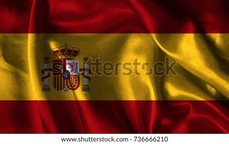 Realistic flag of Spain on the wavy surface of fabric. This flag can be used in design.