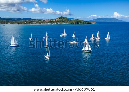 Several sailboats offshore Nosy Be, Madagascar Royalty-Free Stock Photo #736689061