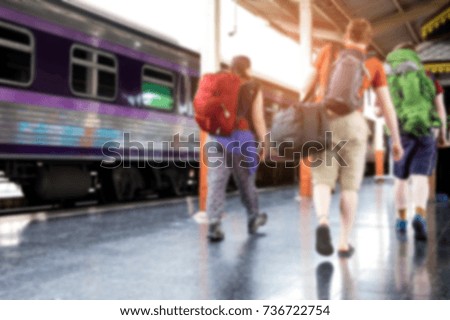 Backpackers traveling by train,Walking on the platform,blurred photo.