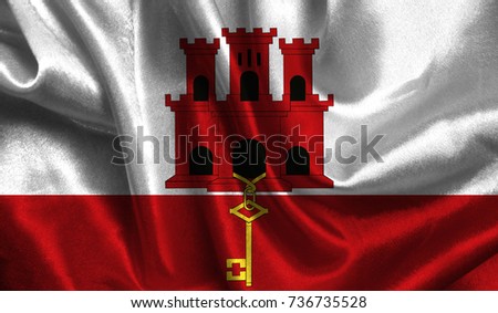 Realistic flag of Gibraltar on the wavy surface of fabric. This flag can be used in design.