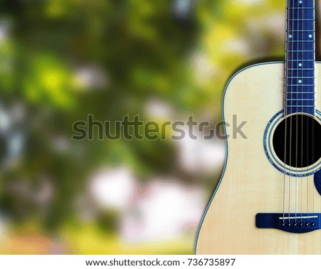 Wood guitar on background blurred clipping path
