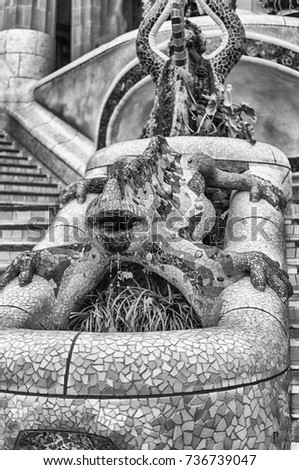 Sculpture with mosaic salamander or lizard, also known as "El Drac" (Dragon in english). The fountain is the most iconic landmark in Park Guell, Barcelona, Catalonia, Spain