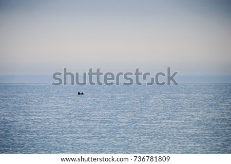 calm in the sea, boat, fishermen / summer / nature of the Far East of Russia