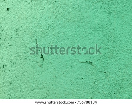 Old green paint cement wall background and texture design