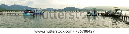 Boat Dock and fishing dock on sunrise. Panorama picture.