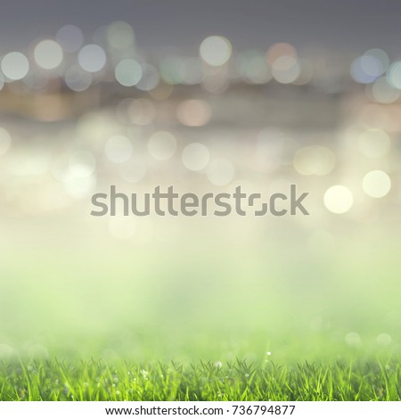 Abstract background green grass field with lights blurred bokeh.