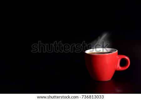 Red cup coffee on balck background for love concept, relax concept, drinking concept for advertisement, selective focus on cup edge