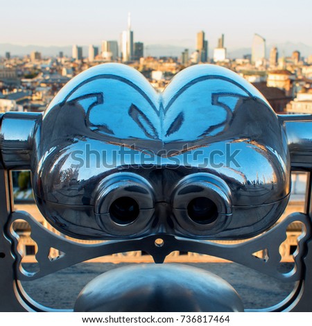 Binoculars coin-operated. View of Milan from the roof of the Duomo