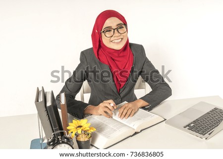 Veiled teenager businesswoman working with muslimah lifestyle.