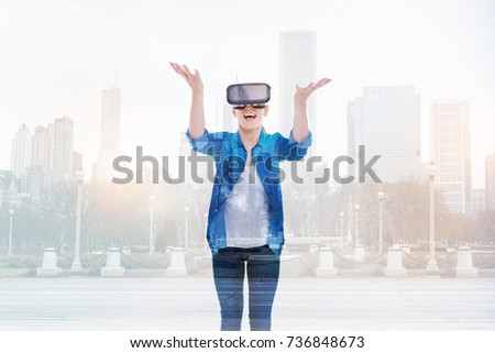 Cheerful woman throwing something in VR game