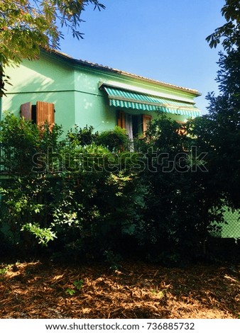 Green house and red leaves (Fano, Italy)