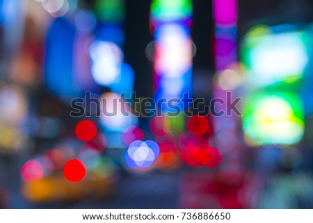 time square at nigh with colorful lighting.     -blurred for background.