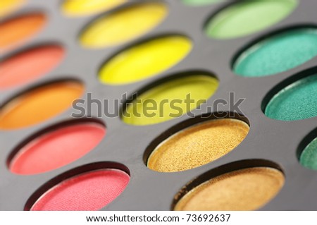 Palette of colorful eye shadows close-up.