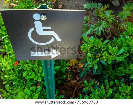 black and white toilet disabled sign for wheelchair person. Wheelchair sign, symbol for disabled person path and walkway. 