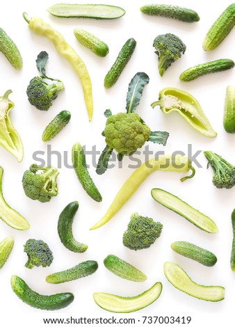 A composition of vegetables from above. Pattern of food. Cabbage broccoli, cucumber, green pepper on white background. Food collage.Top view, flat lay. Food background. Food wallpaper.