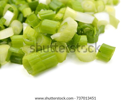Chopped green onions on white