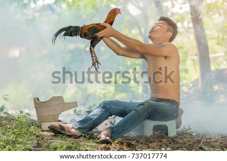 Asian man with his Gamecock.