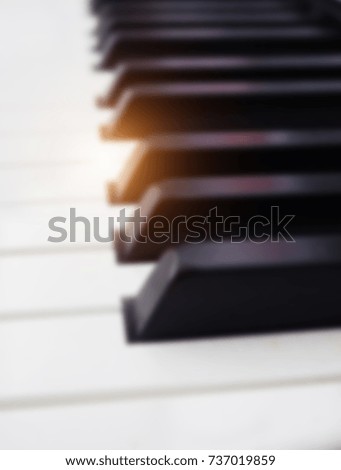 The blurry light design background of piano ,black and white key,abstract art design