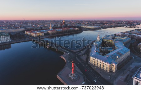 Beautiful aerial morning view of Saint-Petersburg, Russia, The Vasilievskiy Island at sunrise, Isaacs Cathedral, Admiralty, Palace Bridge, cityscape and scenery beyond the city, shot from drone