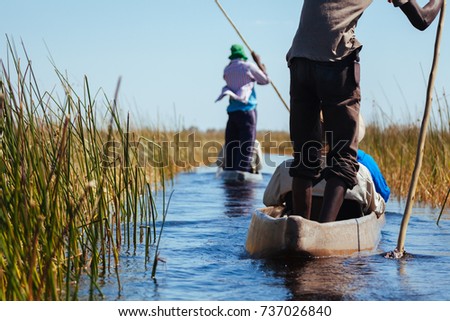 People in canoes, Okavango river, Okanvango delta,  Botswana
