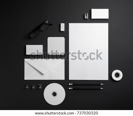 Blank corporate stationery on black paper background. Branding mock up. Template for graphic designers portfolios.