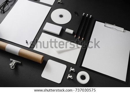 Corporate identity template on black paper background. Photo of blank stationery. Mock up for design portfolios.