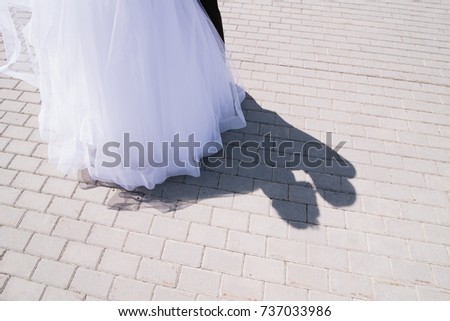 shadow of kissing wedding couple