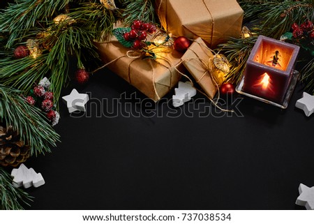 Christmas gifts, christmas tree, candles, colored decor, stars, balls on black background