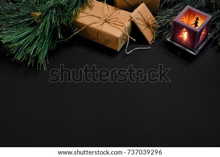 Christmas. Xmas toys and spruce branch on black background top view. Space for text