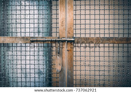 Old rusted iron cage door Vintage style