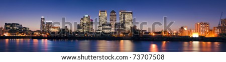 Canary Wharf at dusk, Famous skyscrapers of London's financial district at twilight.