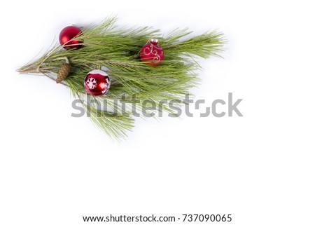 Merry Christmas and Happy new Year- Green Christmas branch with hanging toys and gifts on the pure white background