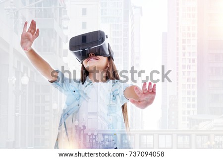 Petite girl testing new VR headset